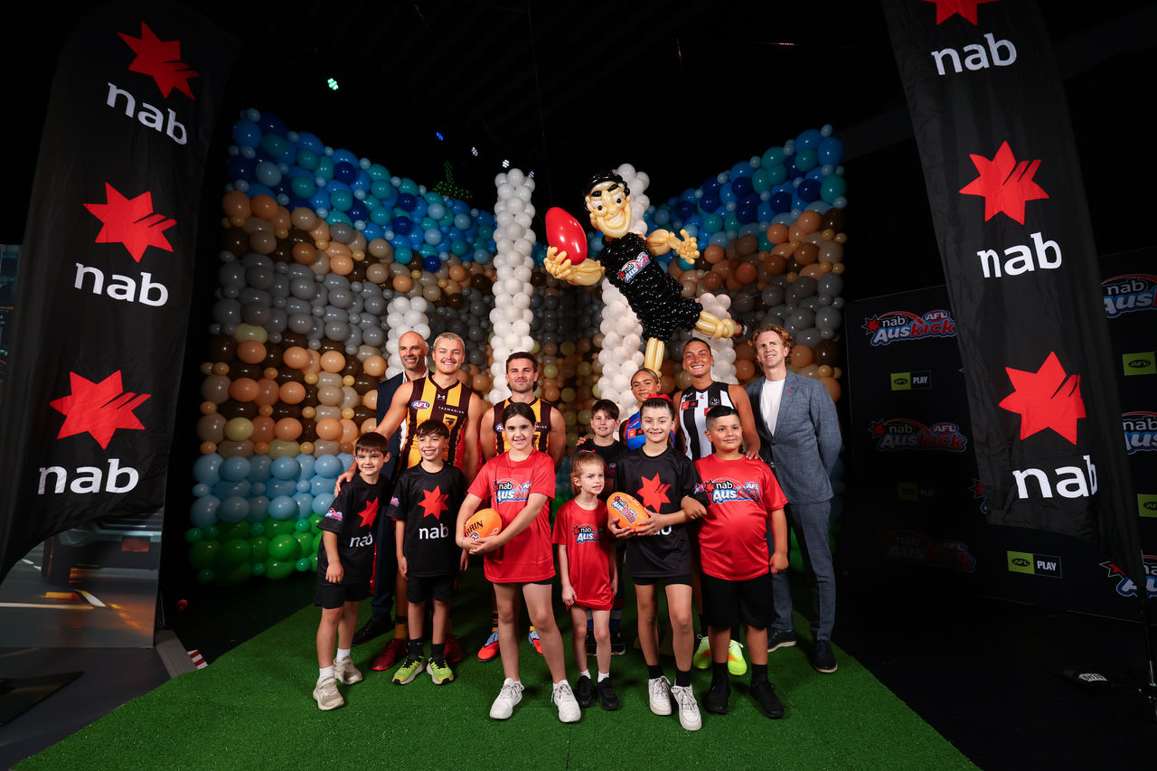 Tom Harley, AFL Chief Operating Officer, Jack Ginnivan of the Hawks, Nick Watson of the Hawks, Jasmyn Smith of the Bulldogs, Ash Centra of the Magpies and Thomas Dobson, NAB Executive Operations, Planning and Partnerships during the 2026 NAB AFL Auskick Launch at Balloon Story, Melbourne Convention and Exhibition Centre (Photo by Josh Chadwick/AFL Photos)