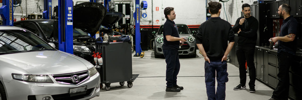 Mechanic Peter Leondis (second from right) with staff