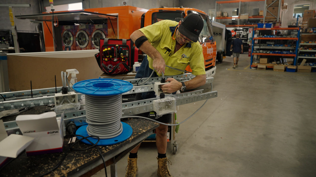 worker on the fabrication tools at Bella Manufacturing factory