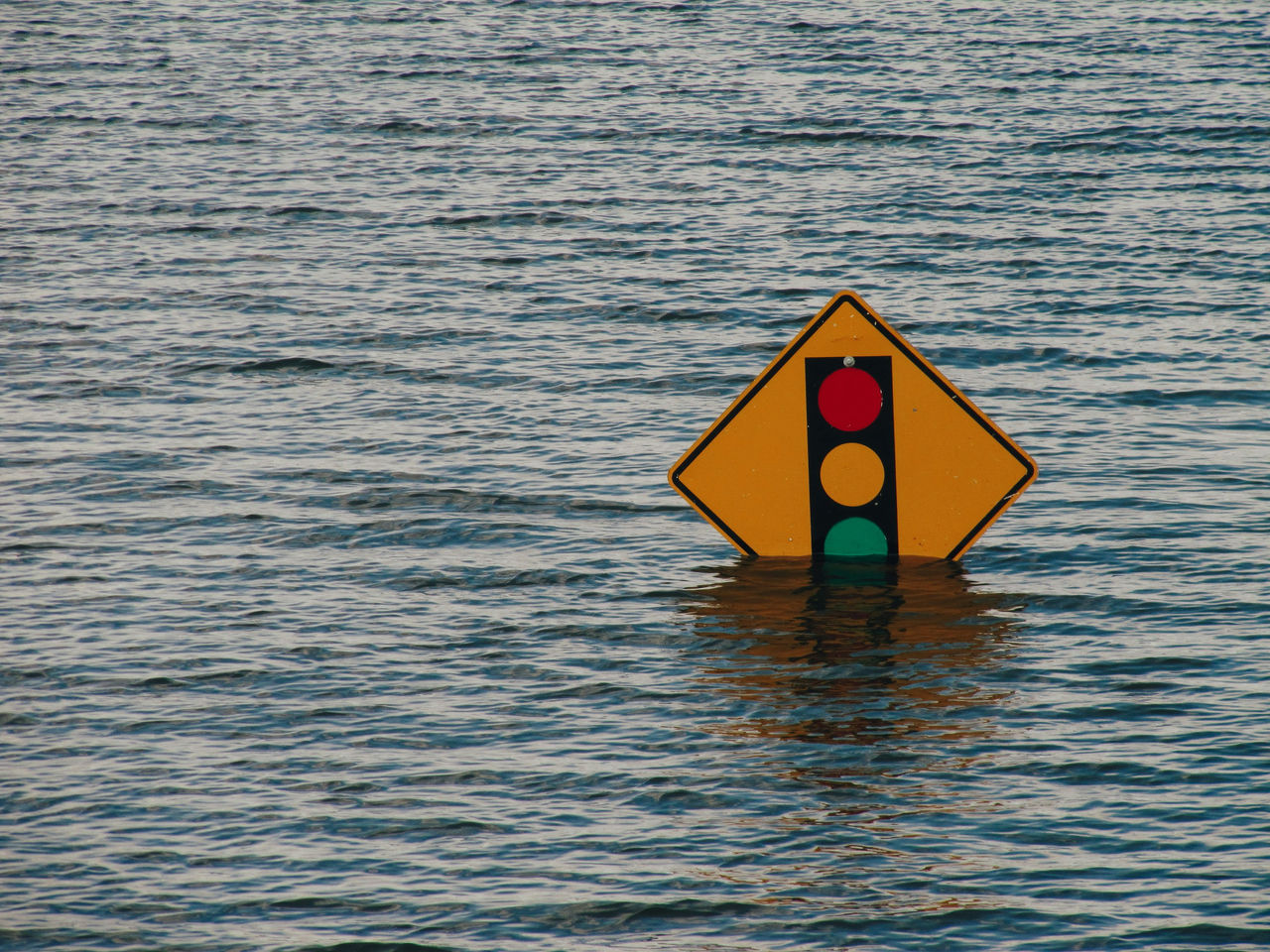 stop sign submerged in flood