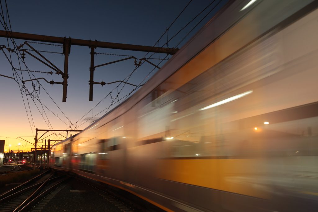 A train in motion in Sydney at dusk