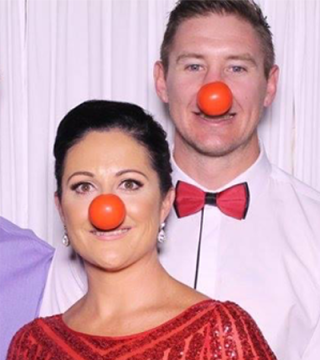 Felicity Burgess and her husband David, wearing red noses