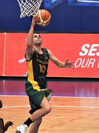 A photo of a man playing basketball.