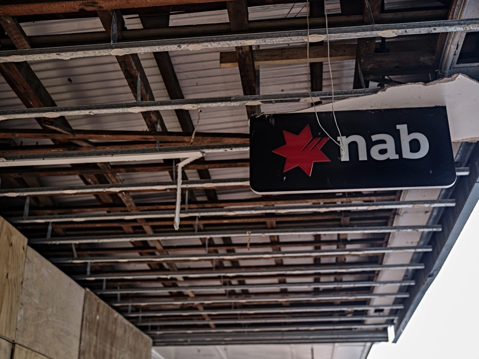 A photo of a NAB branch sign damaged by floods