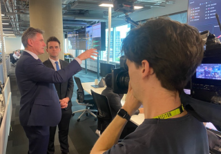 CEO Ross McEwan speaking to a reporter while being filmed in NAB's Fusion Centre