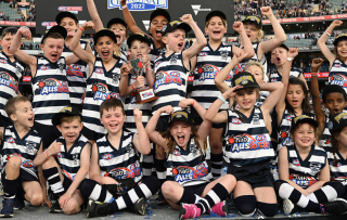 Auskickers on stage at the AFL Grand Final