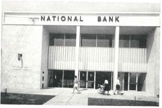 Black and white photo of the outside of a bank branch