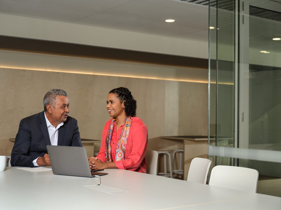 Photograph of two business people conversing