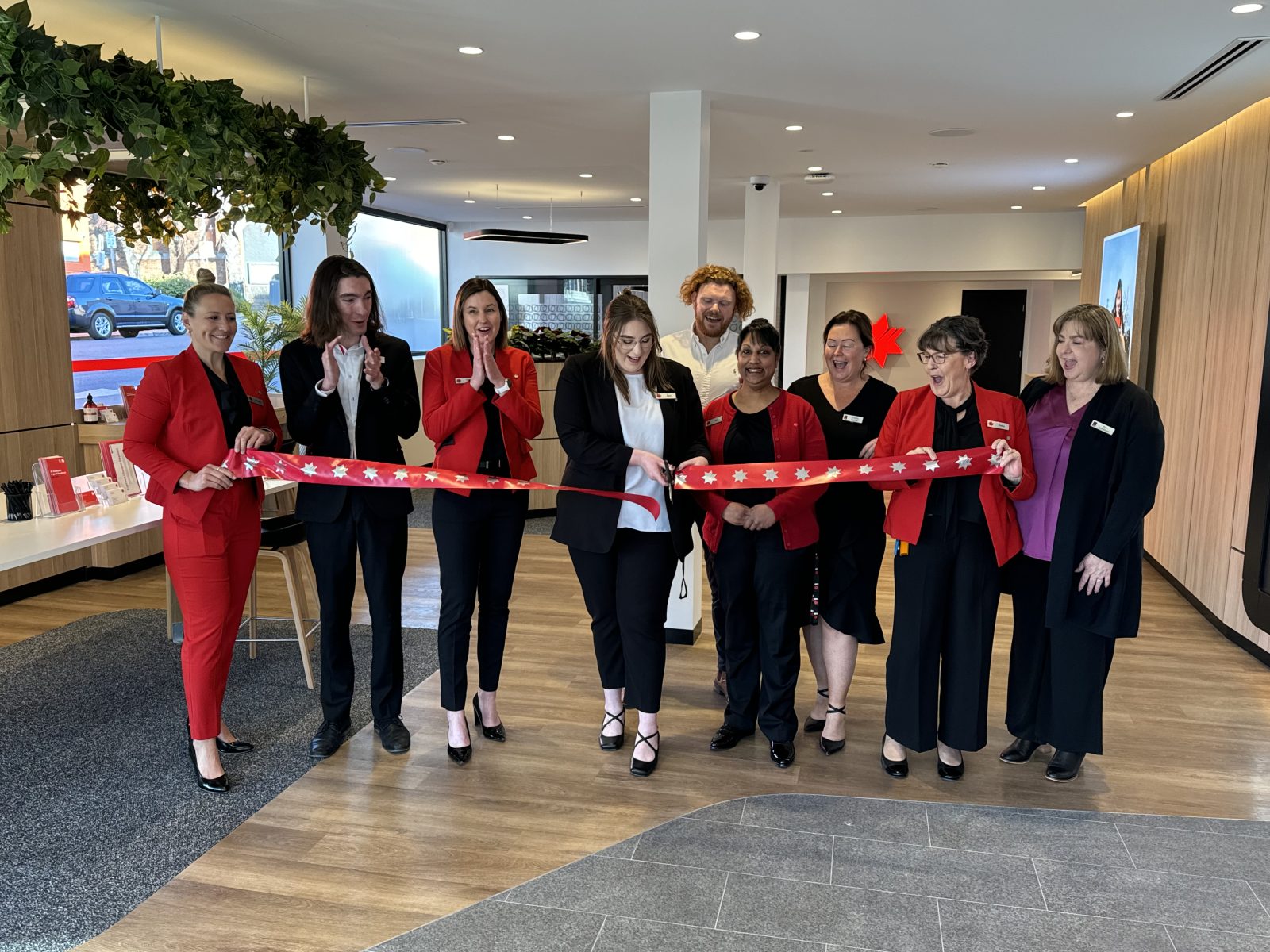 NAB Devonport team cut the ribbon at the new branch.