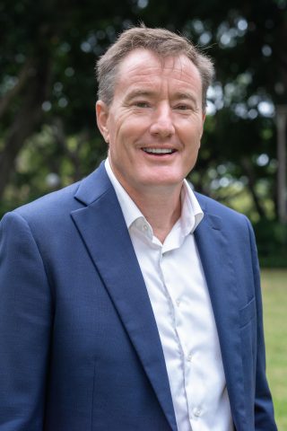 Man smiling at camera for professional headshot