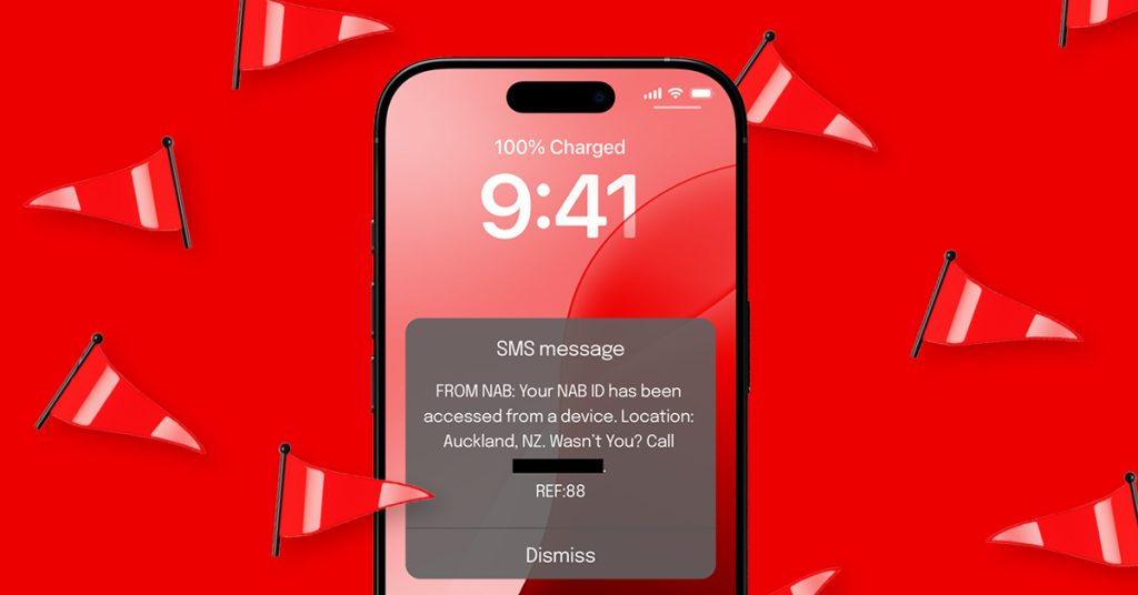 An iphone features a screen with pop-up SMS scam message. The phone is on a red background with red flags.