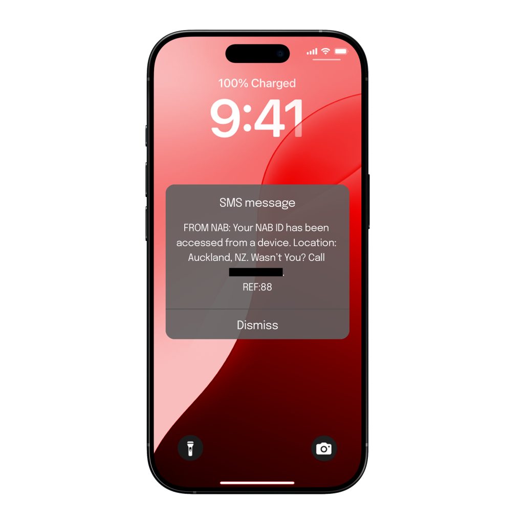 An iphone sceen features a pop-up SMS message that reads 'From NAB: Your NAB ID has been accessed from a device. Location: Auckland, NZ. Wasn't you? Call.'