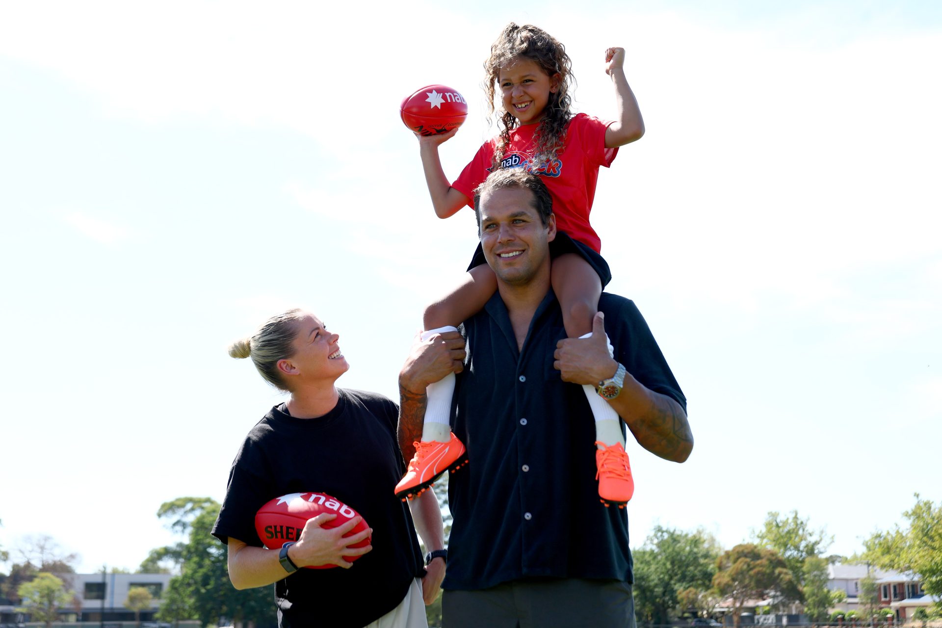 Katie Brennan, Lance Franklin and Zen during a Buddy Franklin TVC at Pitcher Park on March 11, 2025 in Melbourne, Australia.