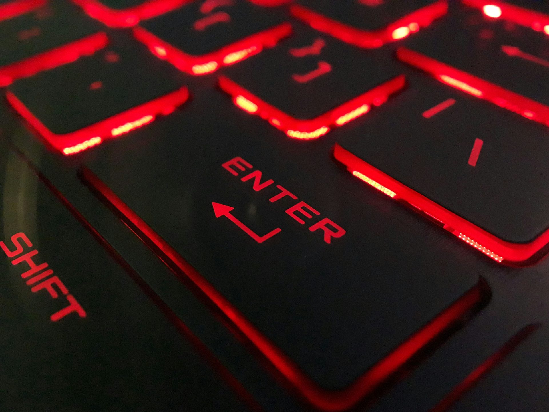 keyboard with black letters and a red blow