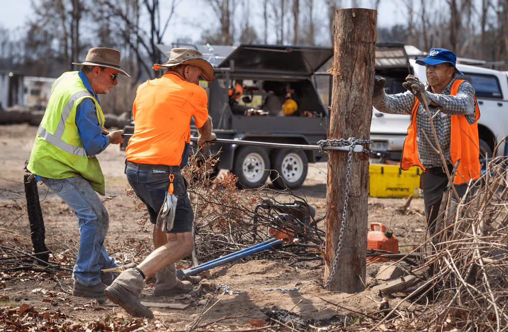 BlazeAid volunteers repairing a farmer's fence